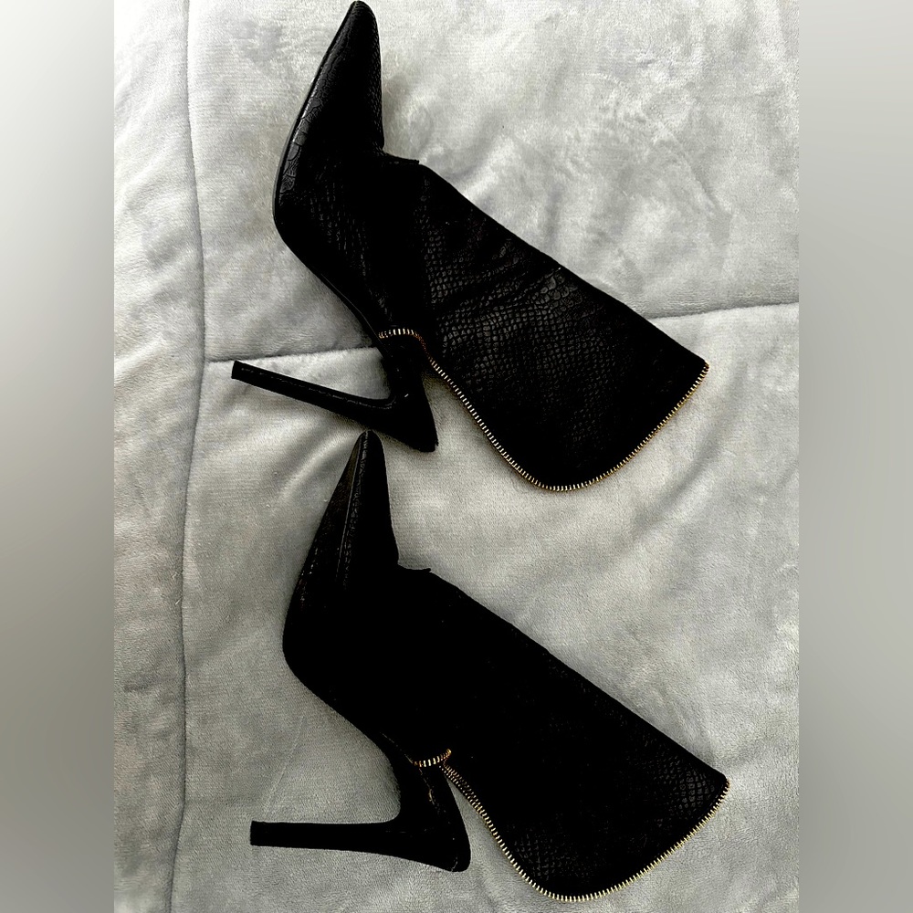 Black backless booties with gold zipper like trim